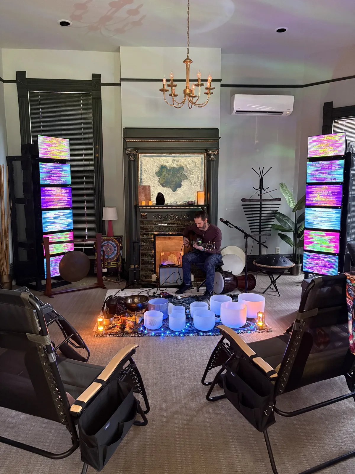Brad Hamilton playing crystal singing bowls in the EESystem suite