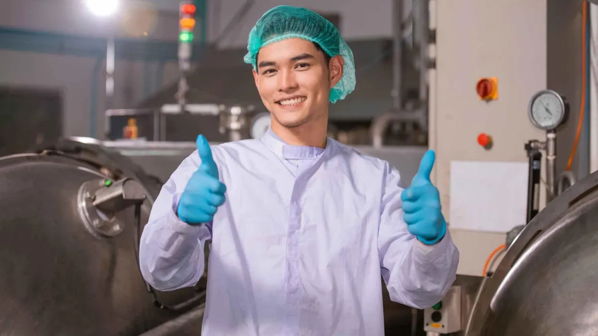 guy giving thumbs up in a food industry business after network pest control commercial service
