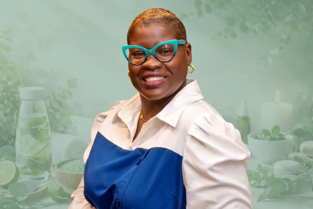 woman in black tank top and black pants bending her body on floor