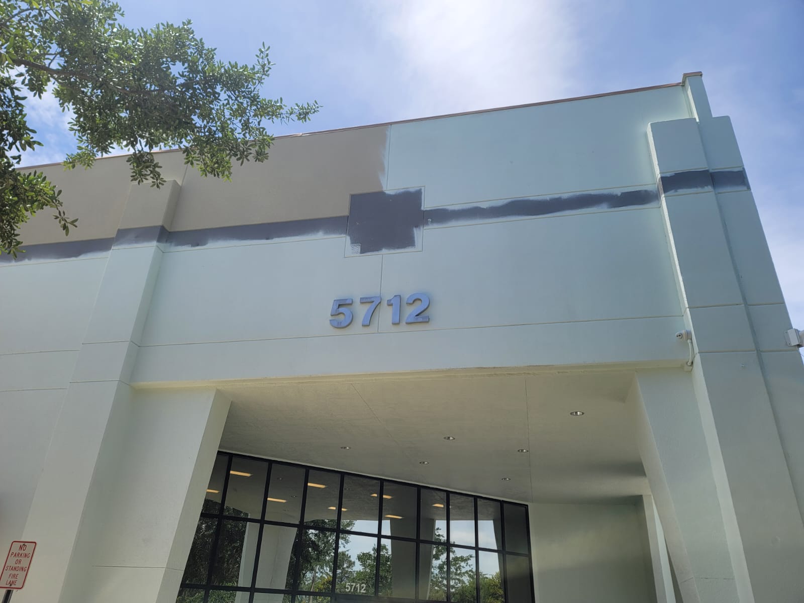 Interior living room refresh with soft neutral walls and crisp white trim, natural sunlight from windows.