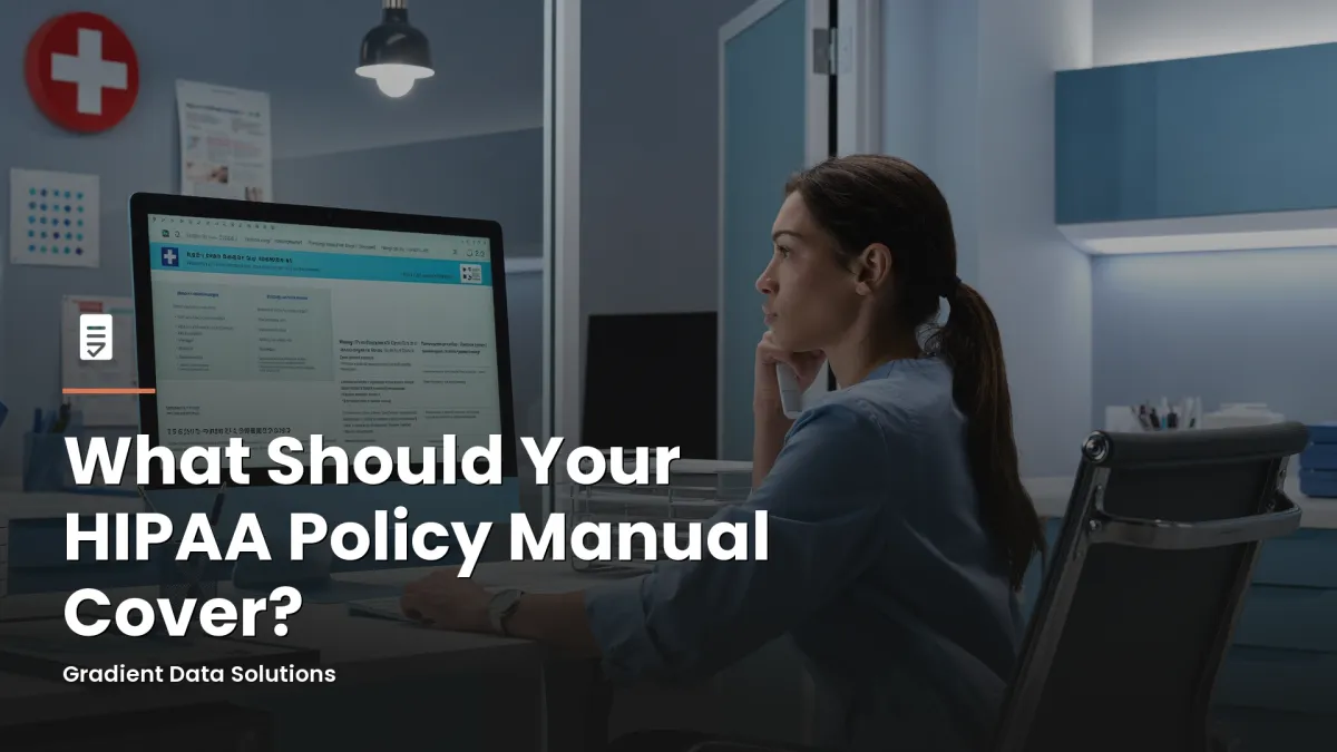 Healthcare practice administrator reviewing HIPAA policy documentation at a modern medical office workstation