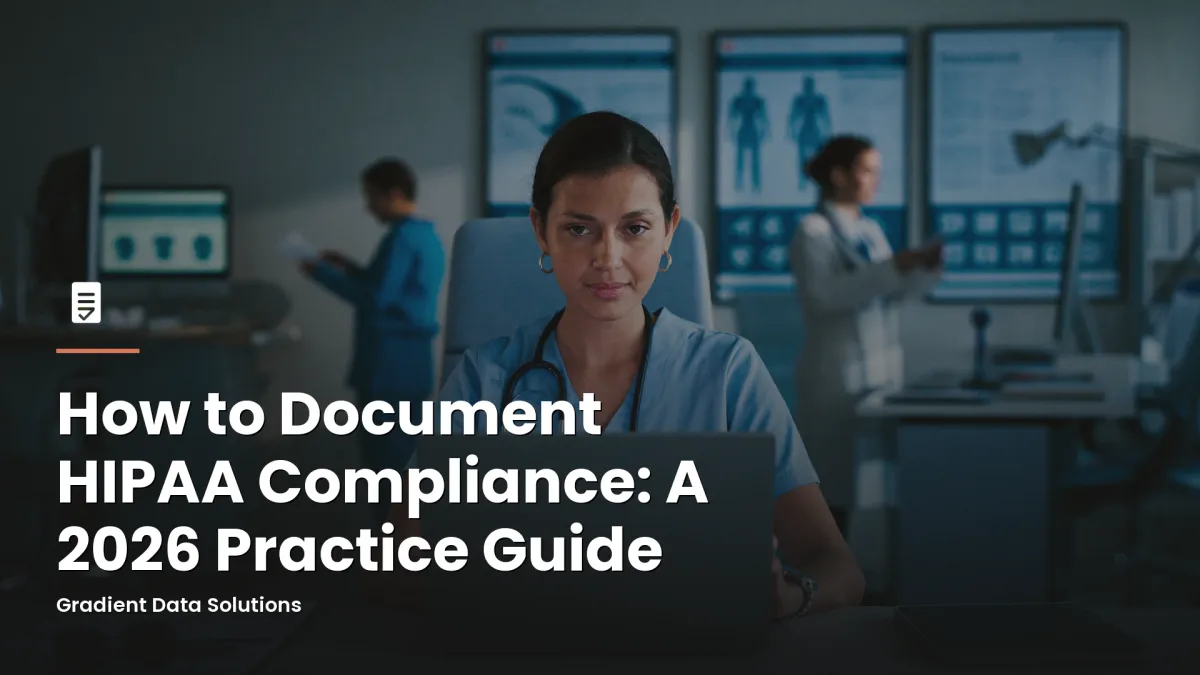 Practice administrator reviewing HIPAA compliance documentation at medical office workstation