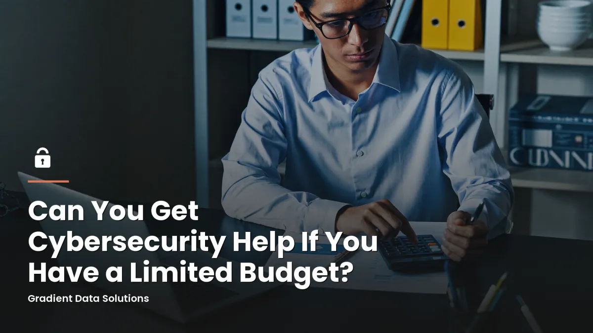 Small business owner reviewing a monthly budget with a laptop and calculator