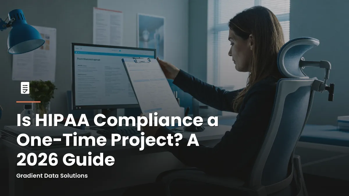 Practice administrator reviewing HIPAA compliance documents at medical office workstation