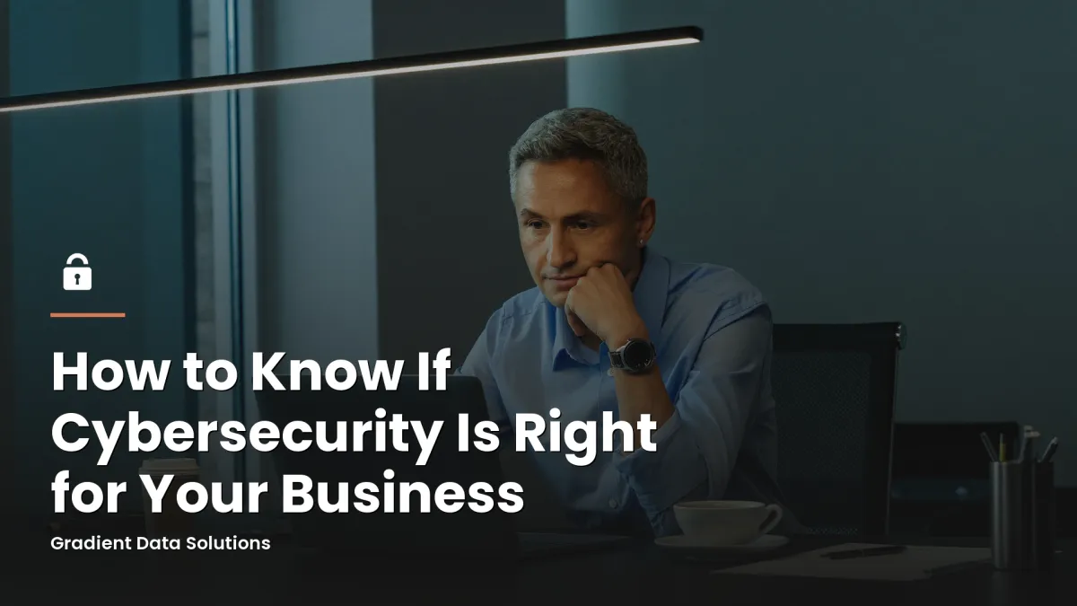 Small business owner weighing cybersecurity options at a modern office desk