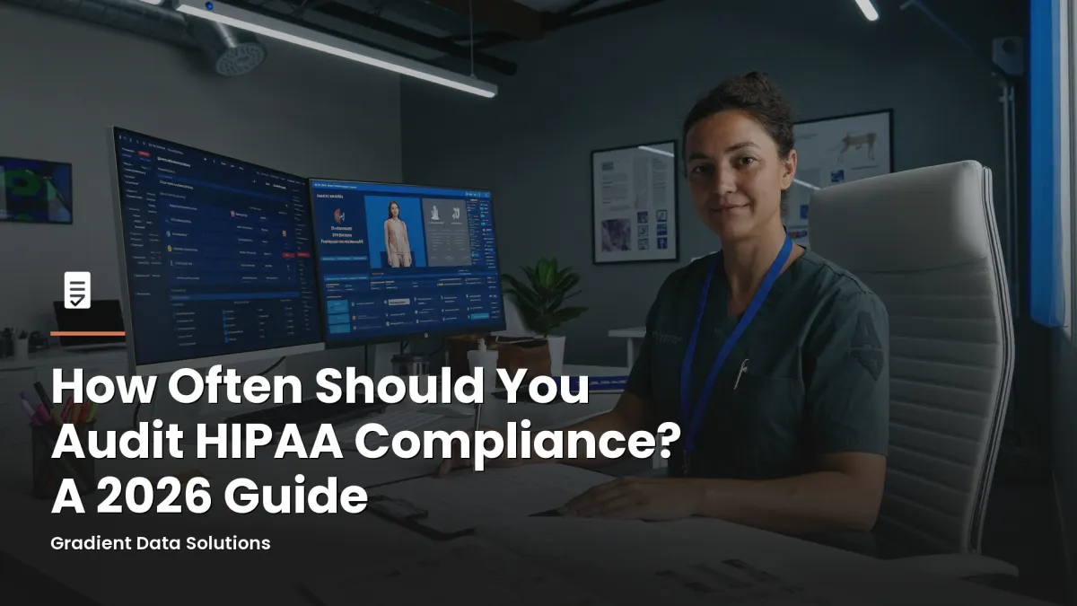 Practice administrator reviewing HIPAA compliance documents at a modern medical office workstation