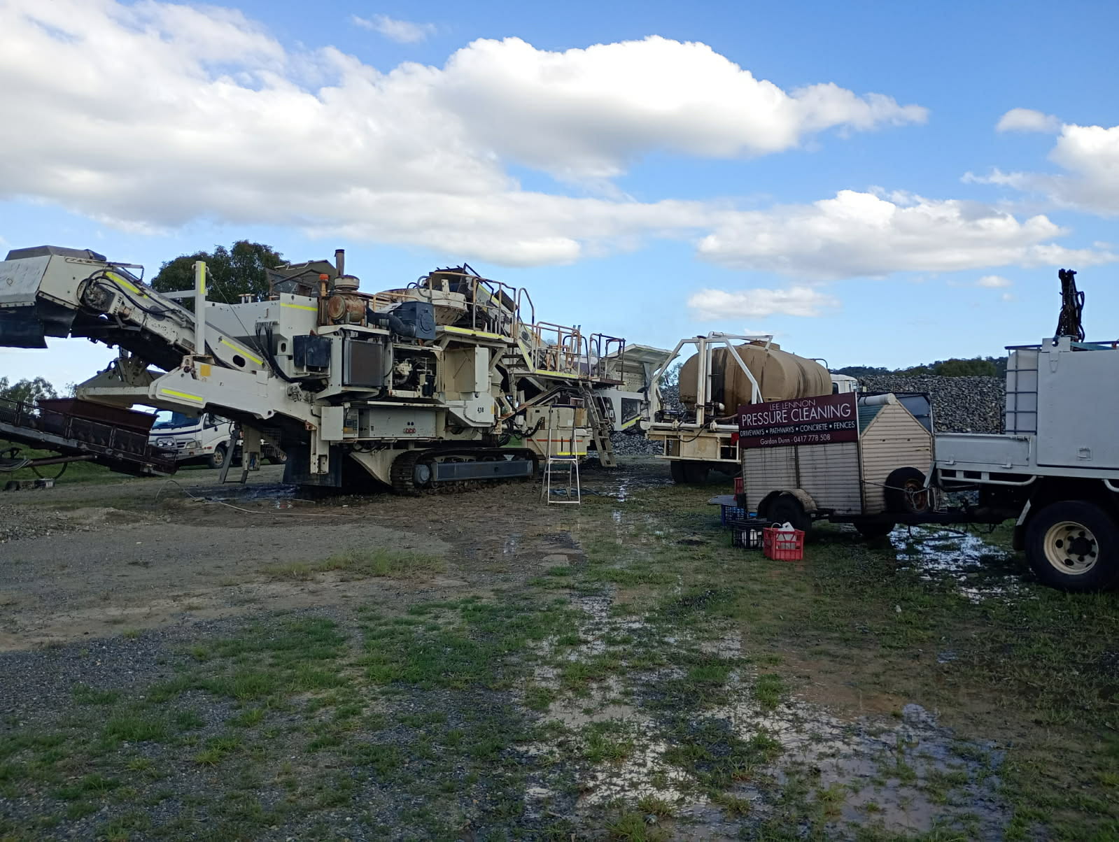 trucks and tractors on fields being pressure cleaned
