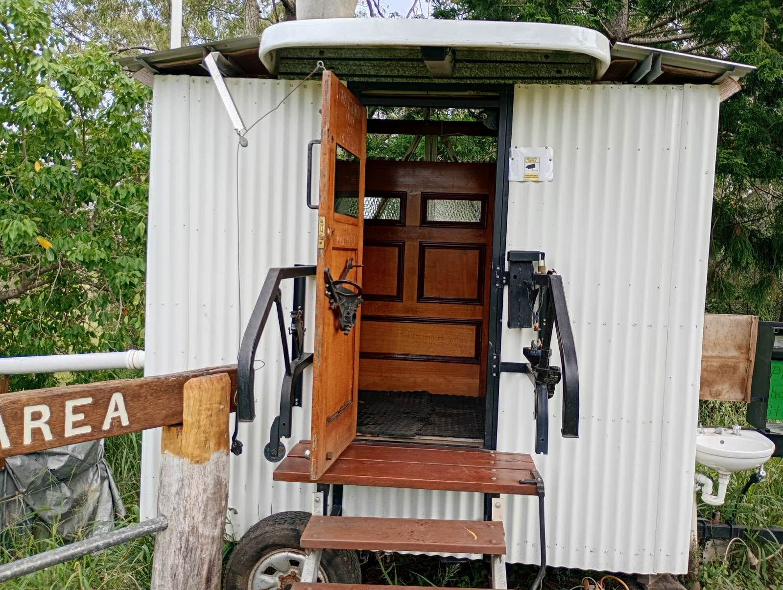 outside of a shed with wooden door open