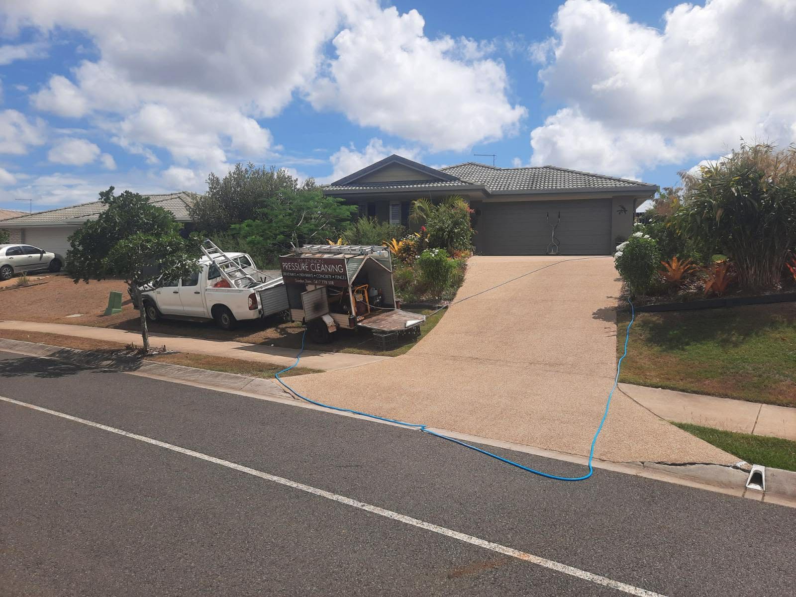 cars with trailer parked alongside street