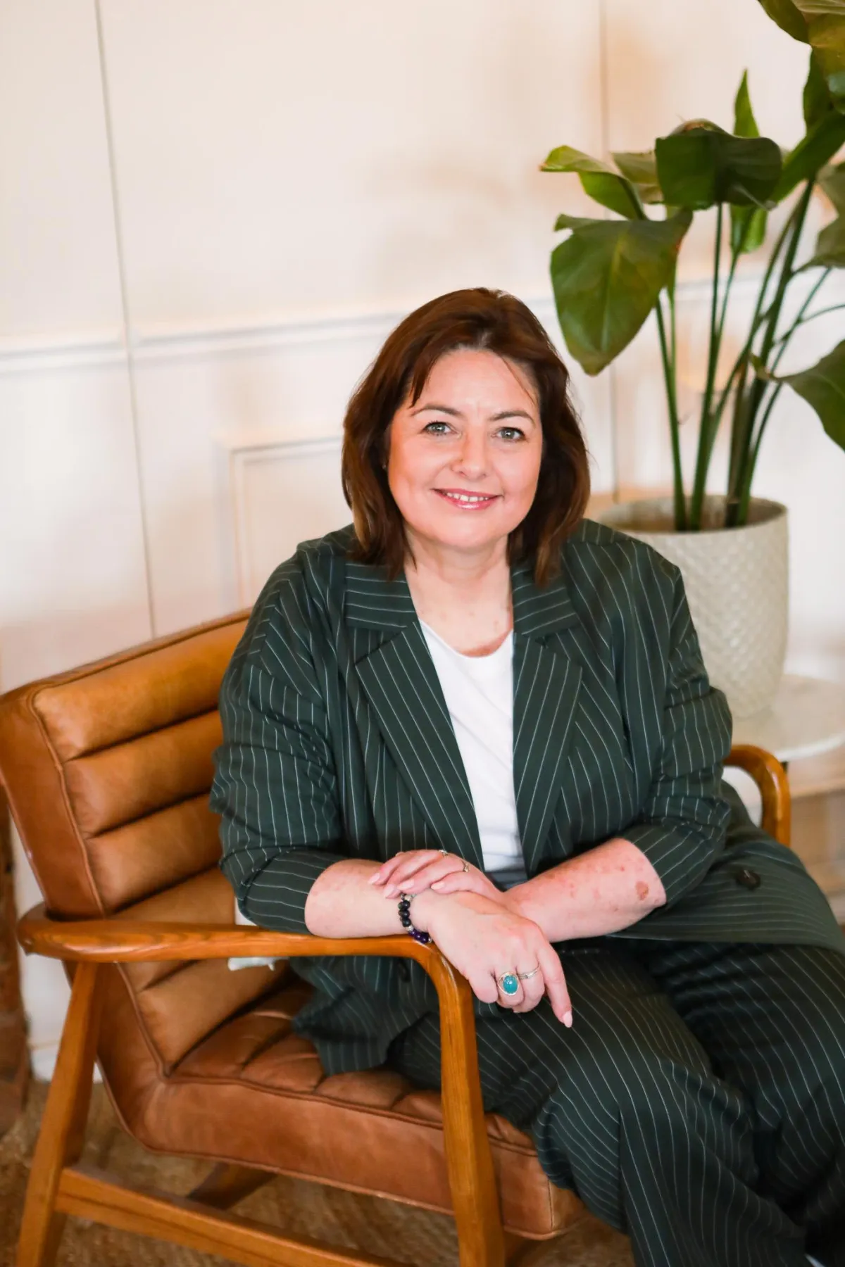 Elissa wearing blue and smiling straight at the camera