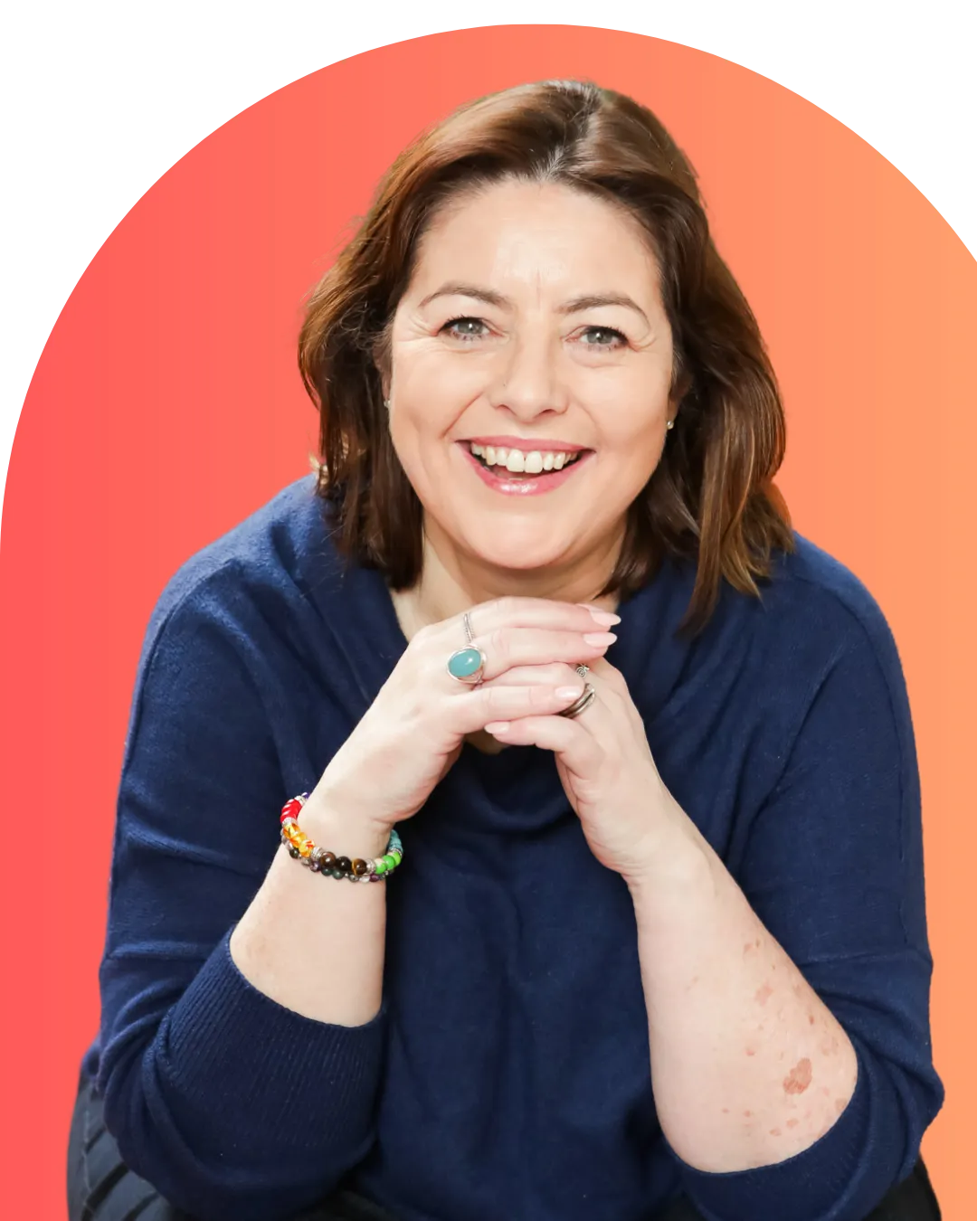 Elissa wearing blue and smiling straight at the camera