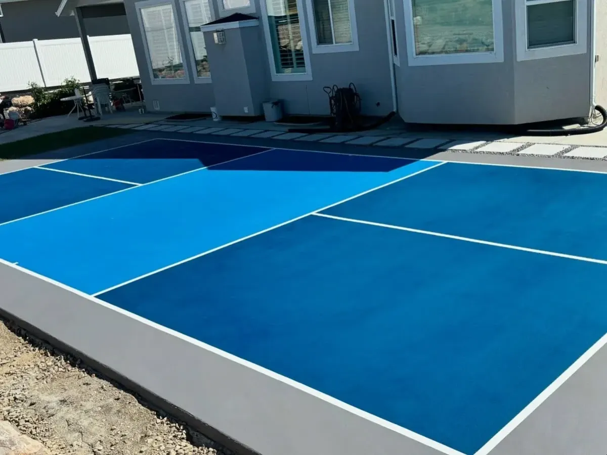 image of a concrete backyard pickleball court installed