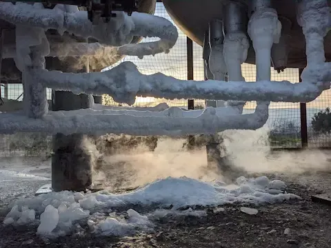 Frozen pipes covered in ice causing winter plumbing issues