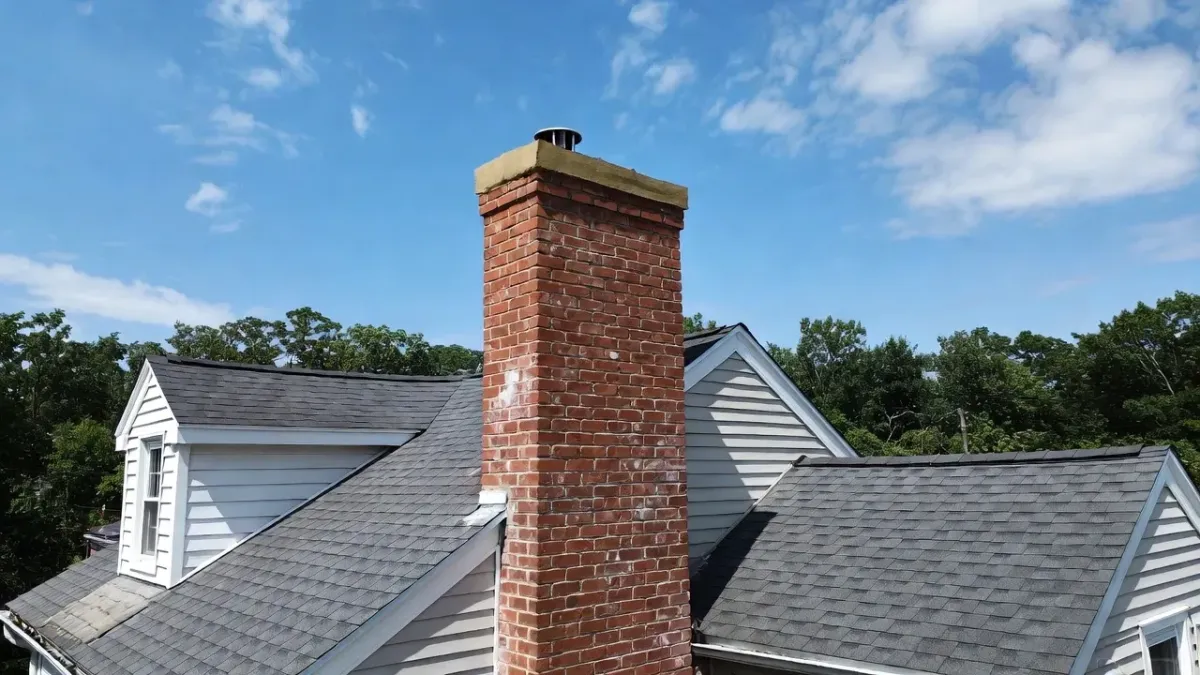 Finished chimney crown repair in Newburyport MA with smooth sealed concrete top