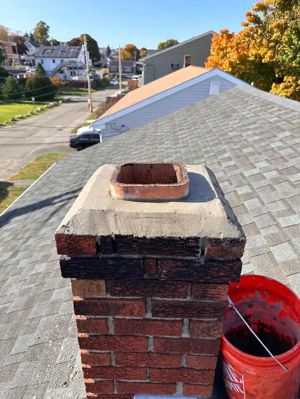 Chimney liner installation in Newburyport MA with professional two-man crew