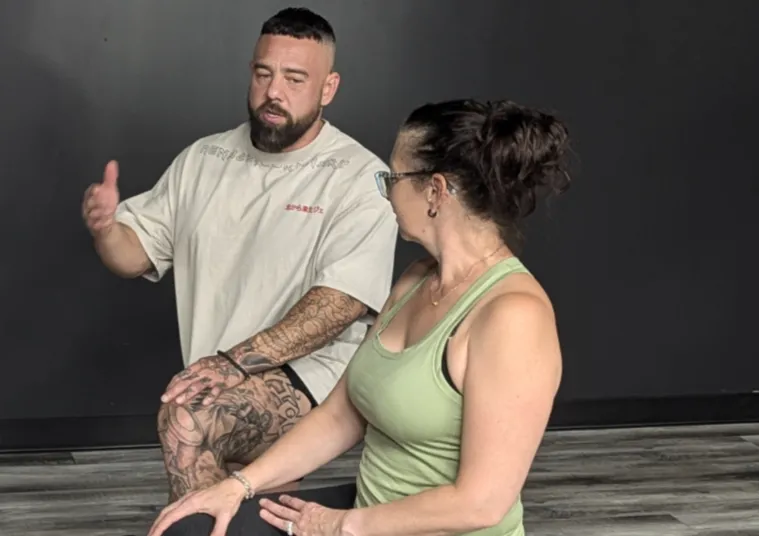 person facing down and holding two rods