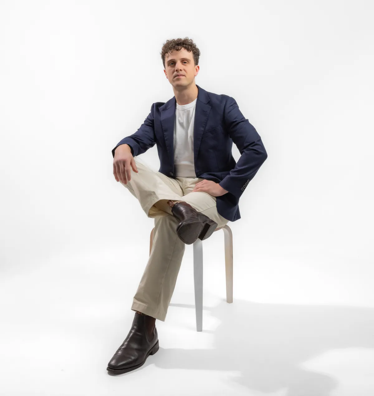 gray concrete road between brown and green leaf trees at daytime