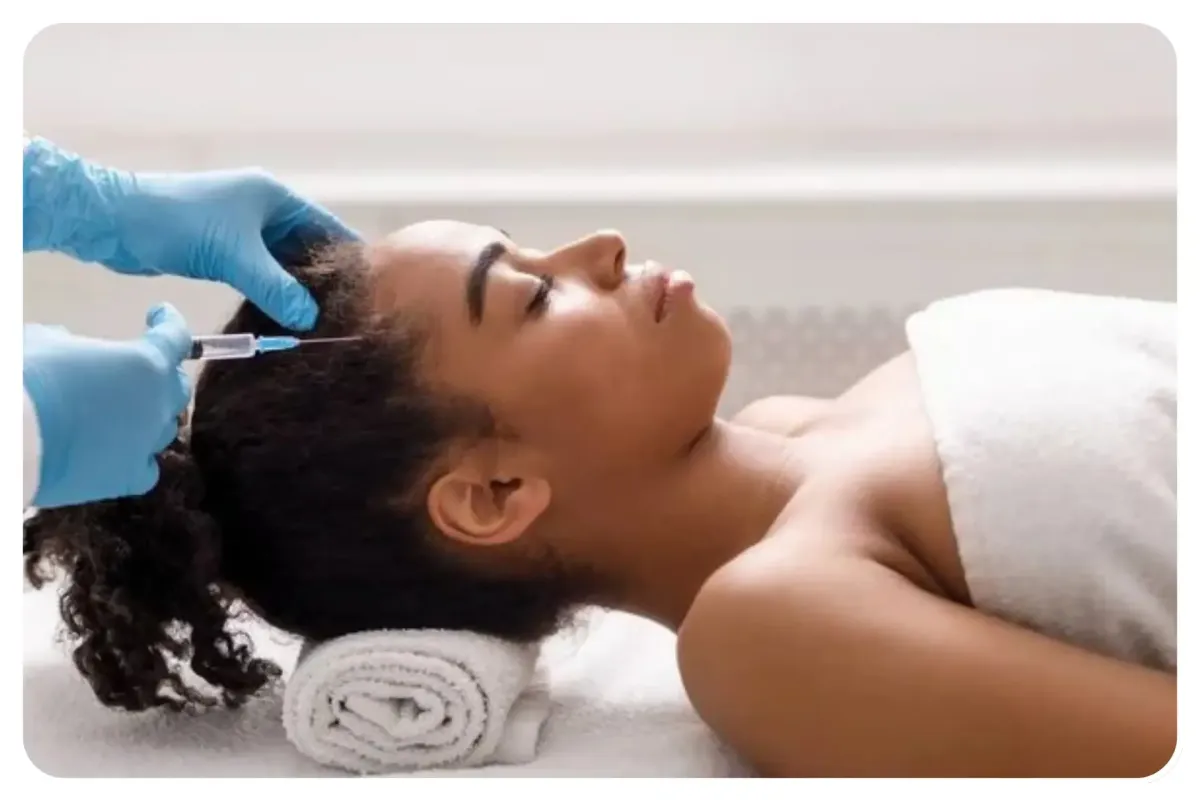 Nurse performing anti-wrinkle Botox treatment with collagen and PRP hair restoration products in a modern clinic setting