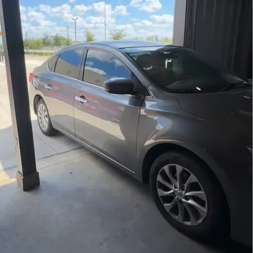 Gray sedan window tint in Missouri City TX with heat blocking film
