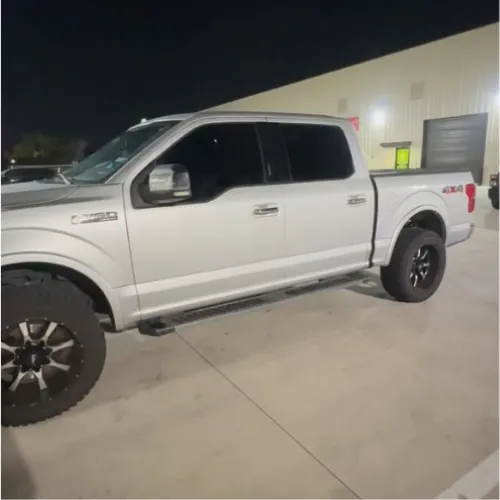 Silver pickup window tint in Sugar Land TX with dark ceramic film installation