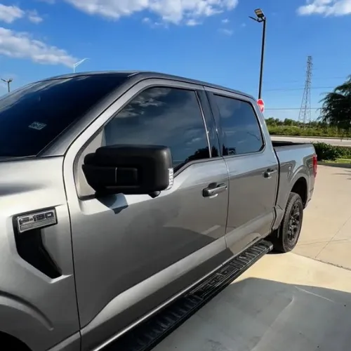 Ford truck window tint in Sugar Land TX with front windshield shade