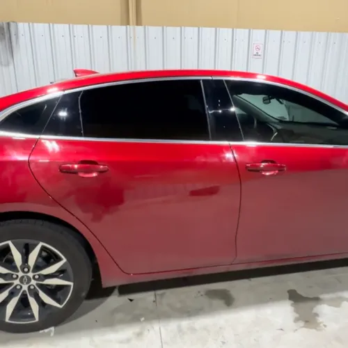 Red sedan window tint in Houston TX with dark privacy film