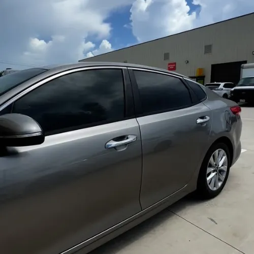 Window tint service near Sugar Land TX on sedan with UV protection film