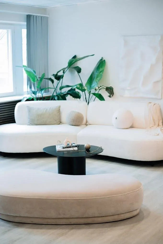 black metal chairs and table near white wall