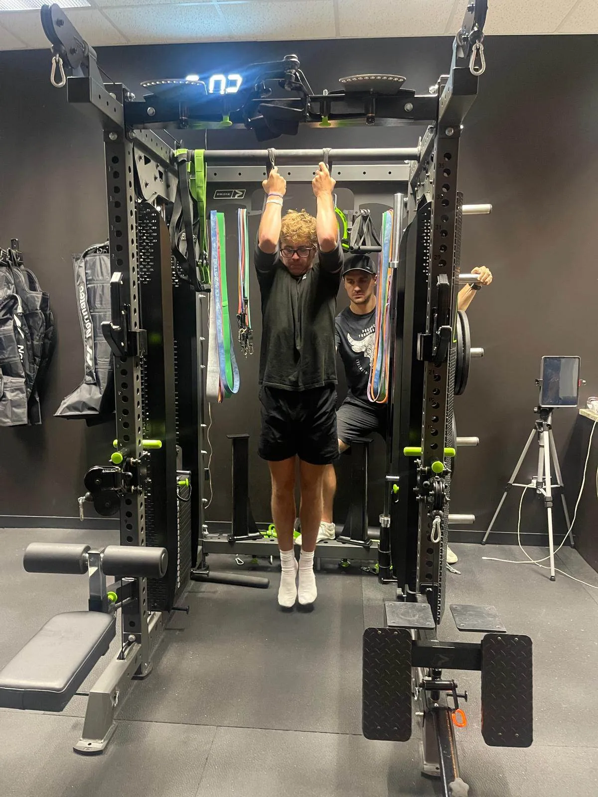 Young athletes training on a pull-up rig at Starke Industries