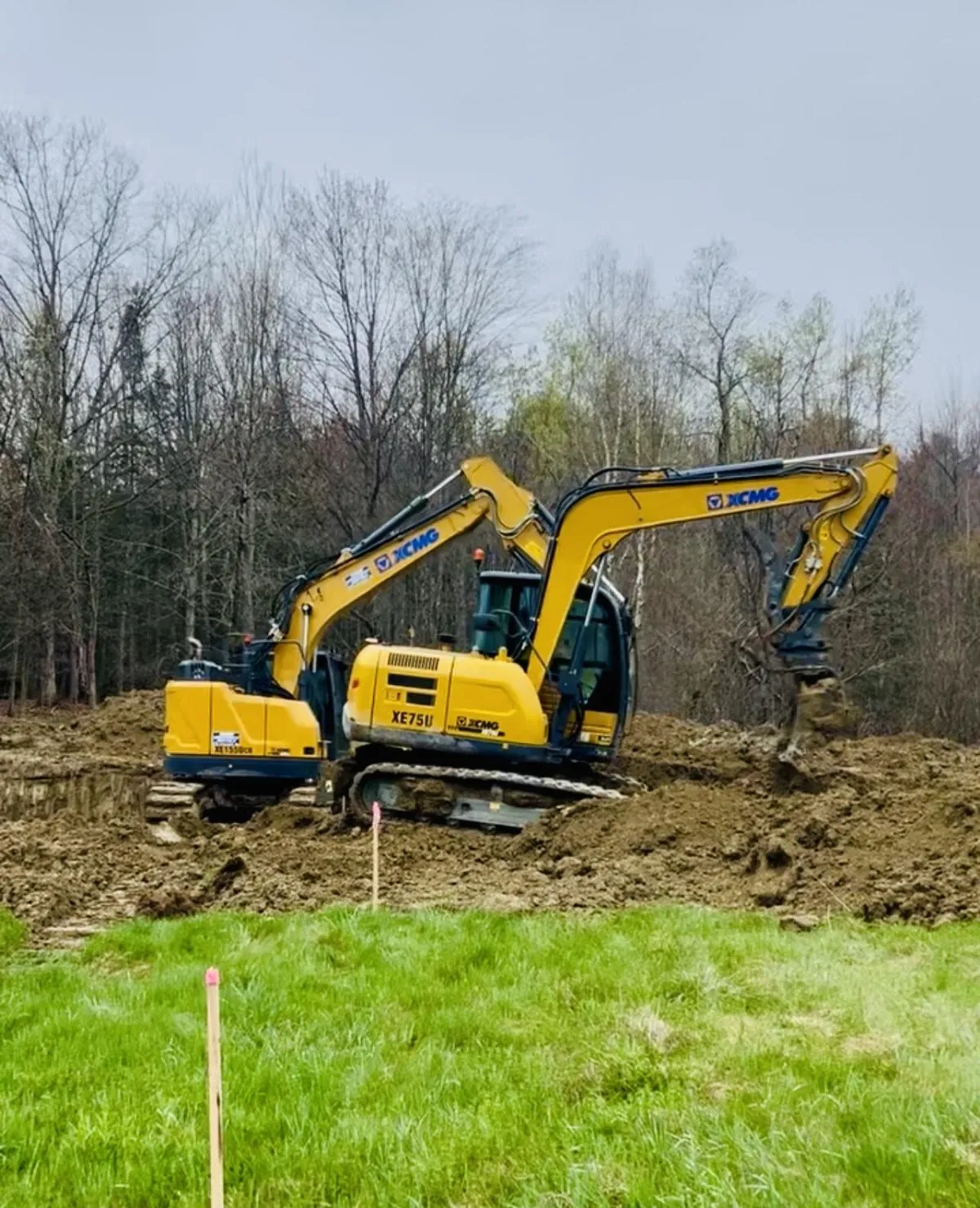 House footers being dug by excavators