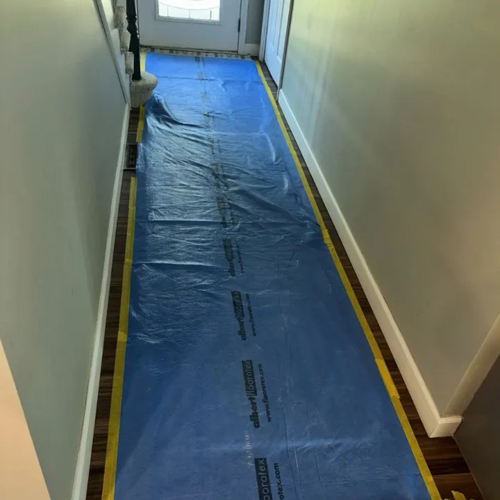 Hallway floor protection laid down by Beverly Restoration and More before starting work in an Omaha home