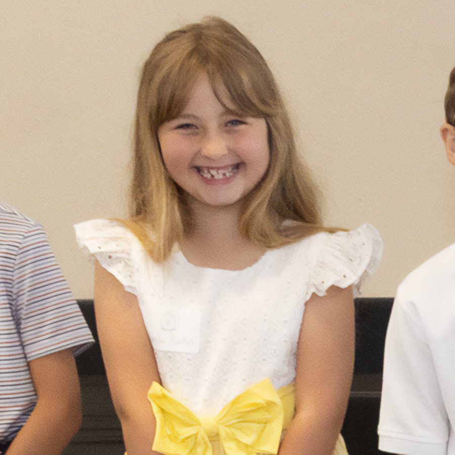 Girl smiling during pre-cotillion class