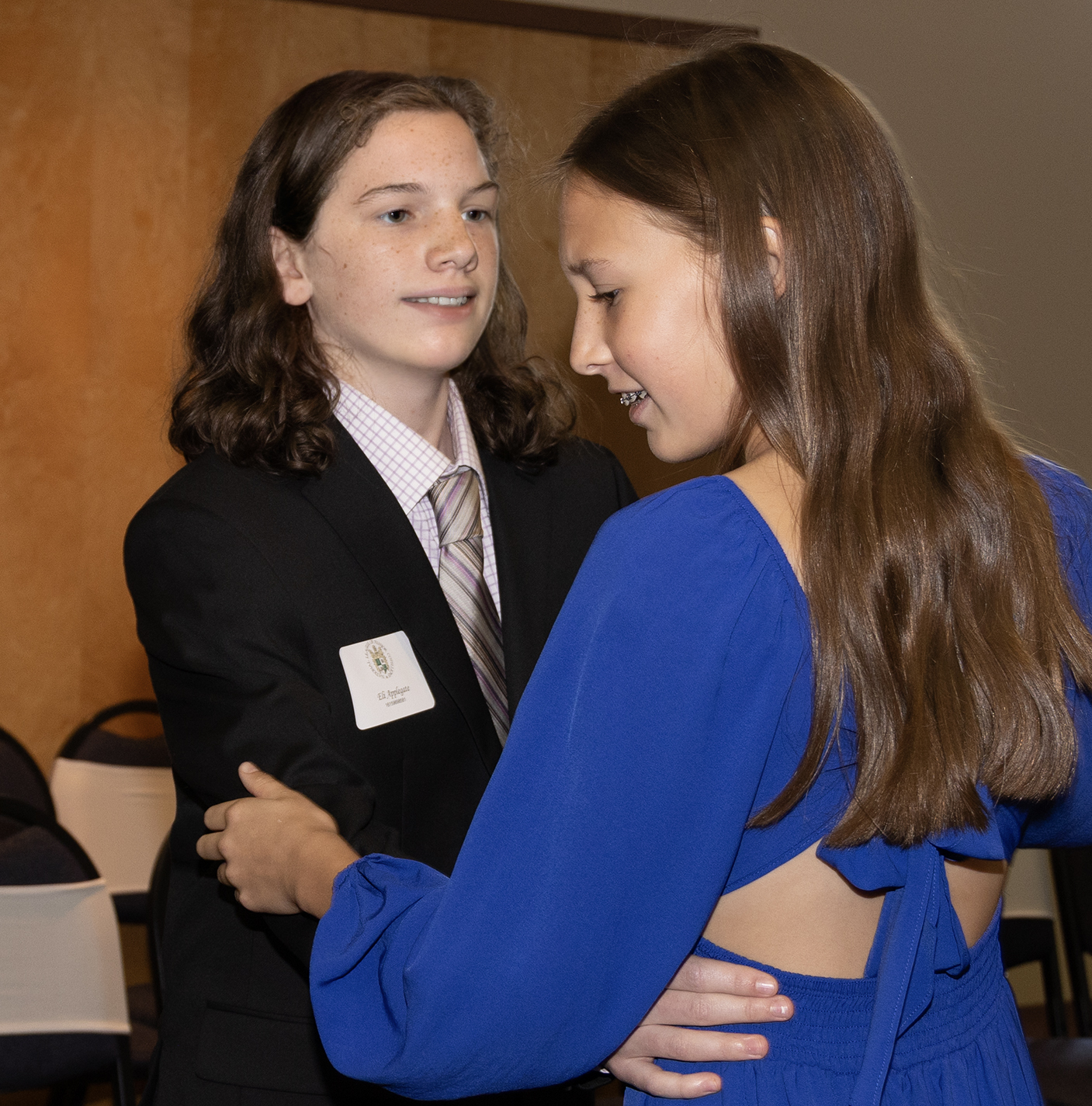 lady and gentlemen students dancing during Junior Cotillion Class and smiling 