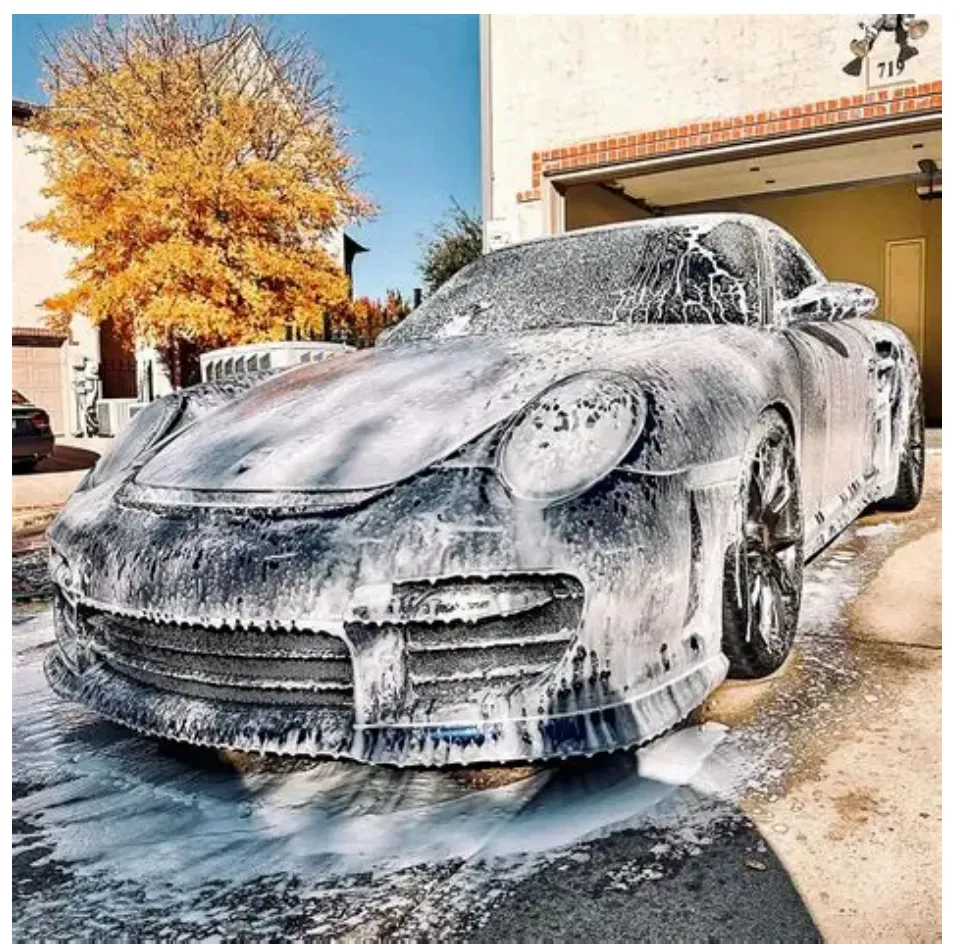 Complete auto detailing in Dallas TX - LG Mobile Detailing foam bath exterior wash on a Porsche at a residential driveway