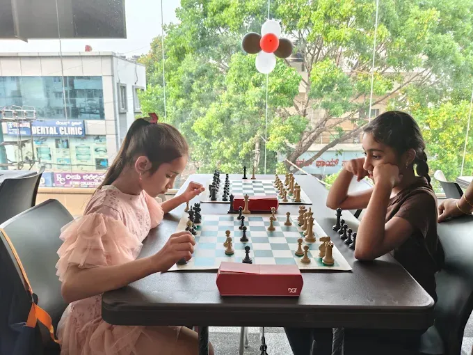 Chess students playing games during a coaching session at CHESS KLUB