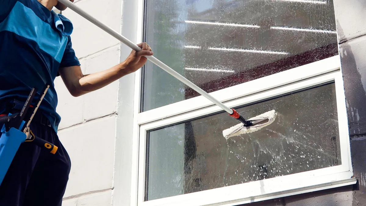 John washing exterior window