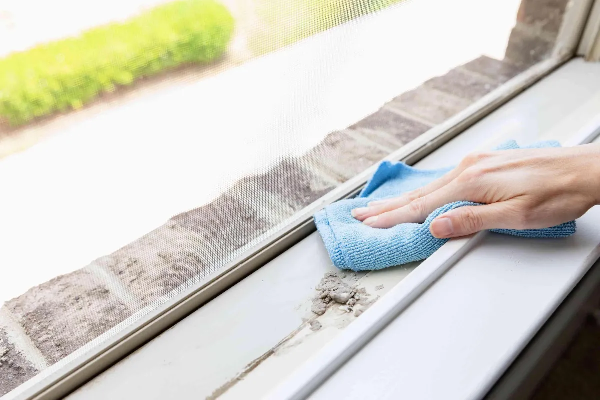 John washing window sill