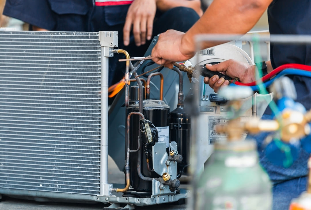 parents with daughter in front of their house smiling