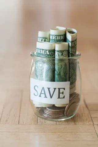 parents with daughter in front of their house smiling