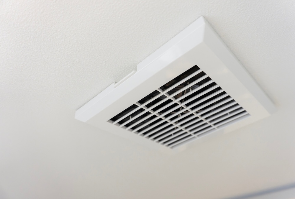 parents with daughter in front of their house smiling