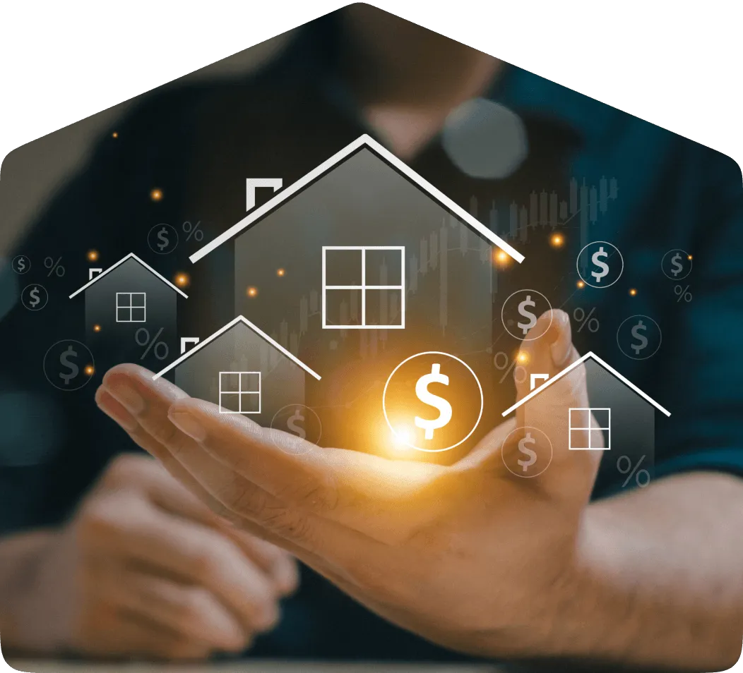 A hand holding images of real estate that show signs of investment growth