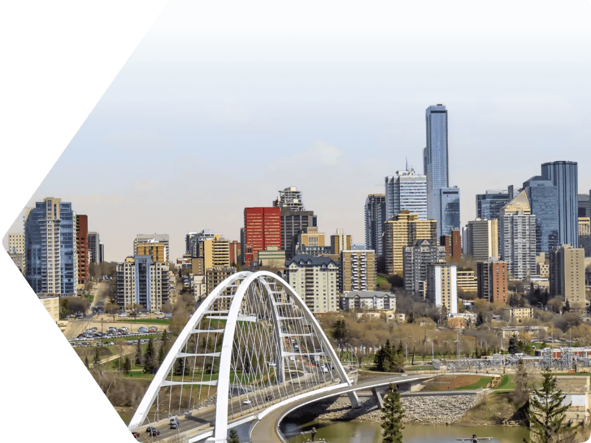 The cityscape of Edmonton, with Walterdale Bridge in the foreground, and the cityscape of urban high rises in the background.