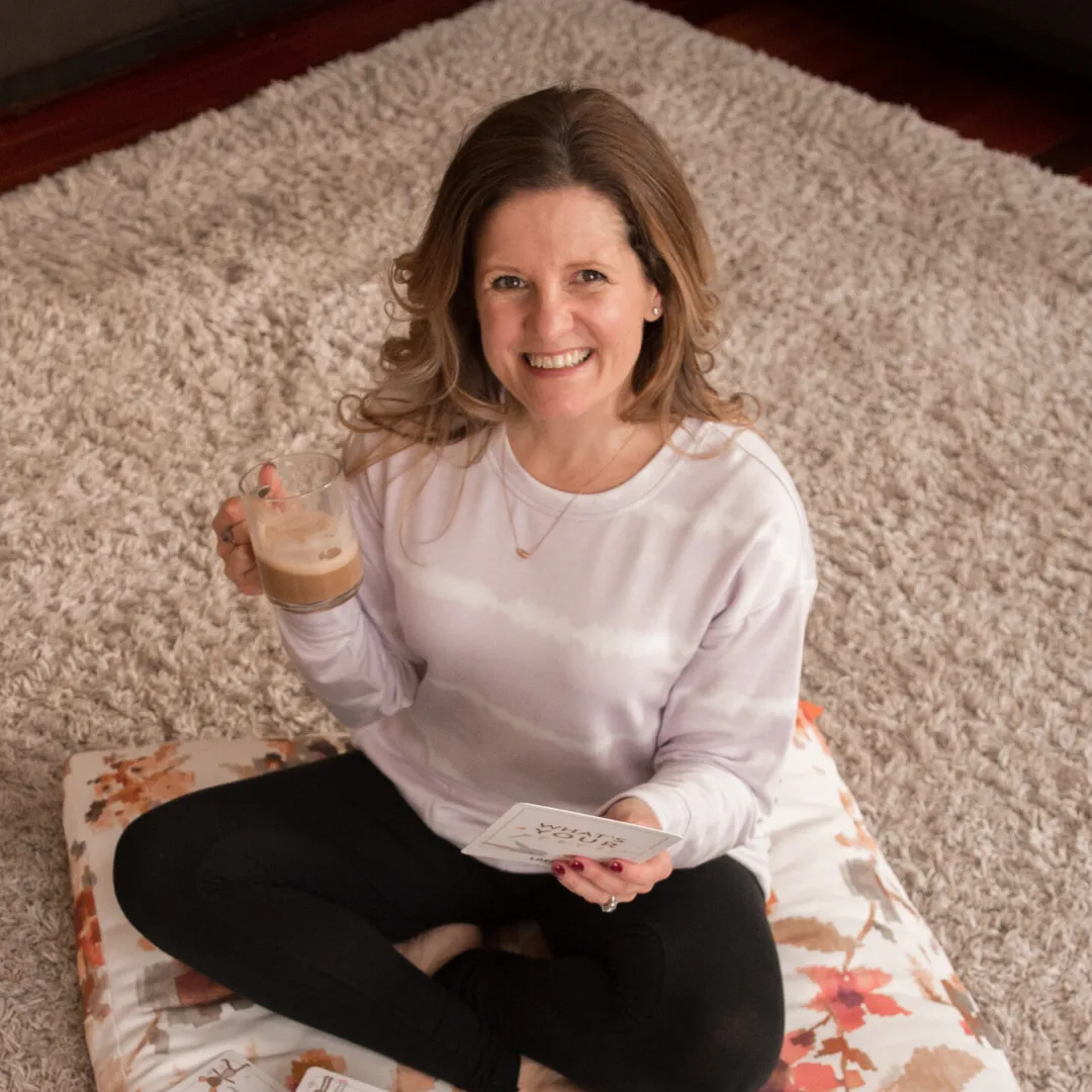 Meditation guide, Rebecca Lira drinking a coffee and smiling at the camera