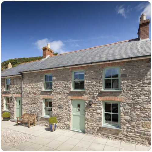 Heritage uPVC sliding sash windows installed in a traditional Yorkshire stone cottage within a conservation area