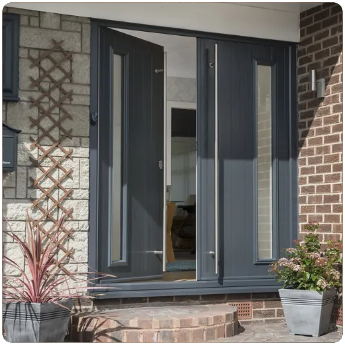 Anthracite grey contemporary composite front door with vertical glazed panels and modern styling on a Yorkshire home
