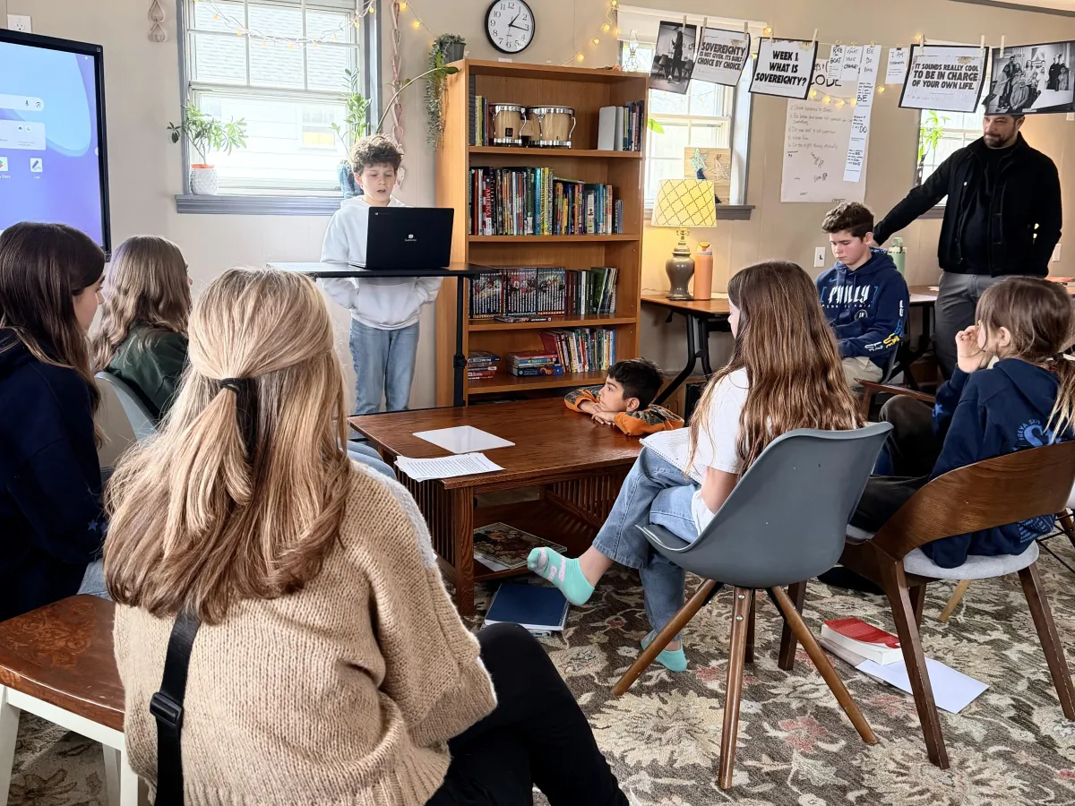 A warm candid photograph showing an authentic community connection between Apogee members