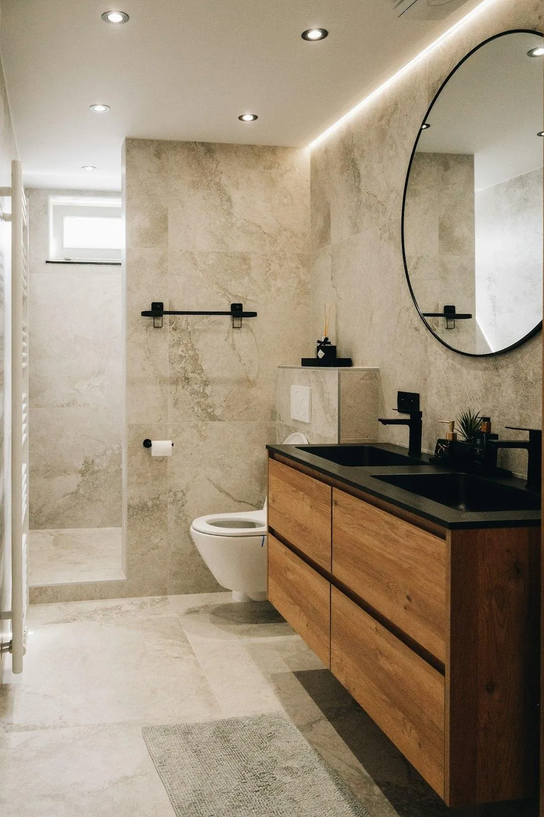 Before and after master bathroom remodel by Renovation Artists