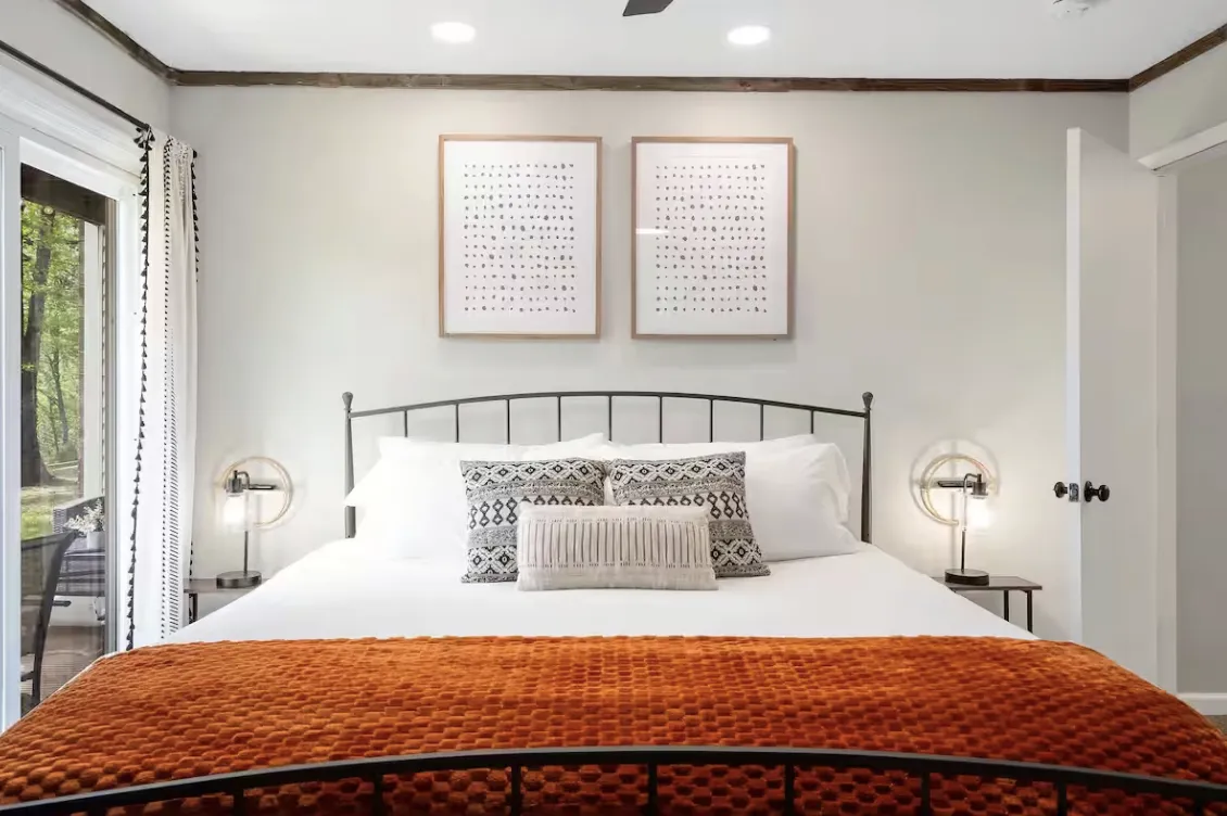 Handcrafted retreat cabin nestled among firs in late-afternoon light.