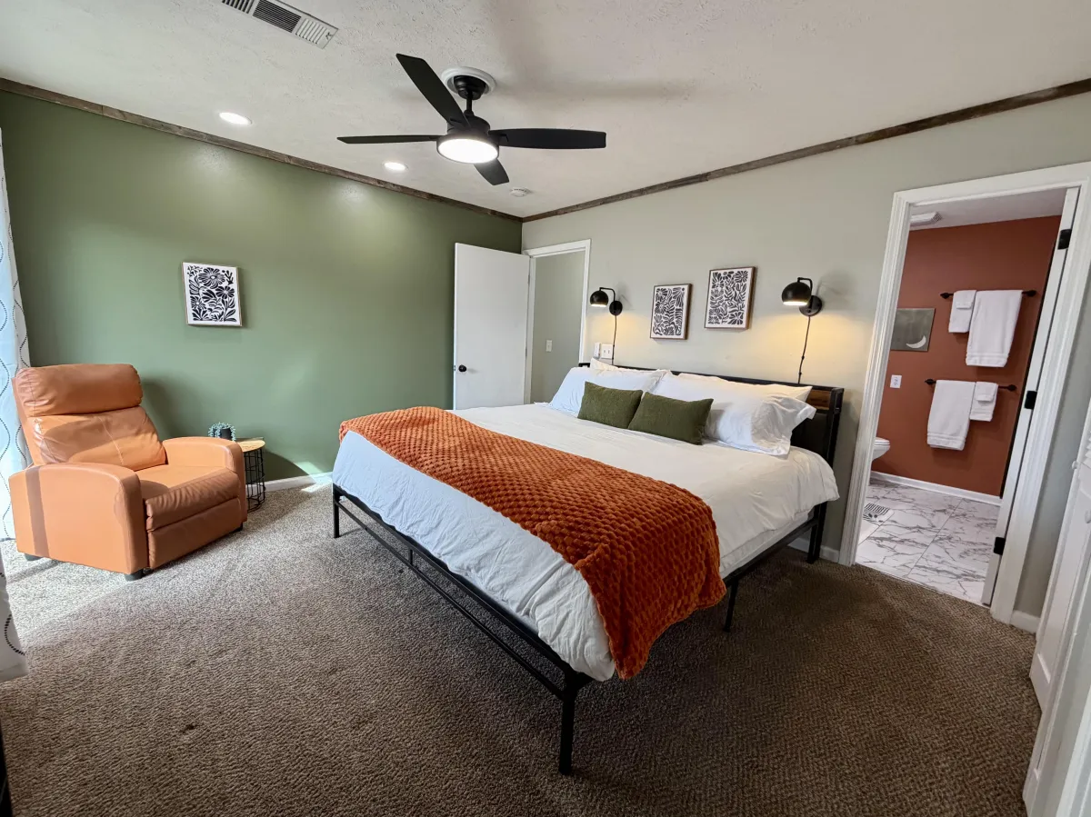 Handcrafted retreat cabin nestled among firs in late-afternoon light.