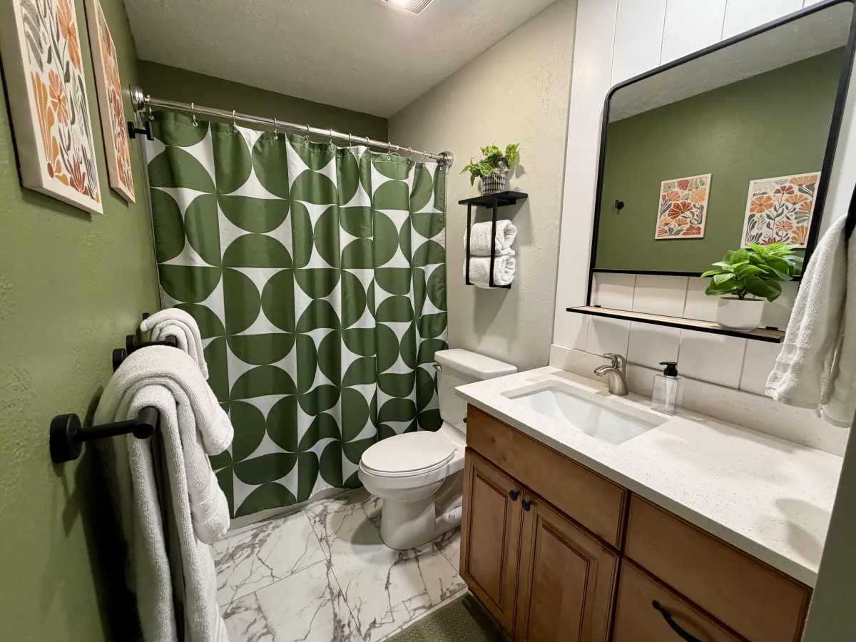 Handcrafted retreat cabin nestled among firs in late-afternoon light.